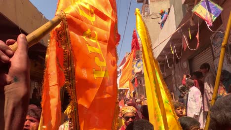 pov-shot-Bazar-public-enjoying-Holi-played-by-Bhagwan's-employees-in-different-costumes-and-public-being-entertained-by-employees