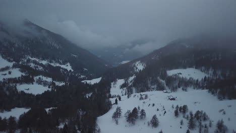 Aerial-drone-shot-of-snowy-mountain-landscape