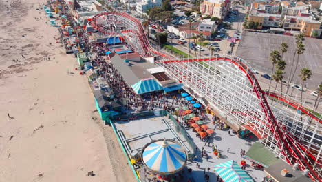 Santa-Cruz-Beach-Boardwalk-oceanfront-amusement-park---tilt-down-aerial