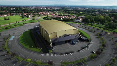 drone-shot-around-le-scarabée-salle-de-spectacle,-theater-in-Roanne-agglomeration-on-a-sunny-summer-day,-loire-department,-auvergne-rhone-alpes-region-in-french-countryside