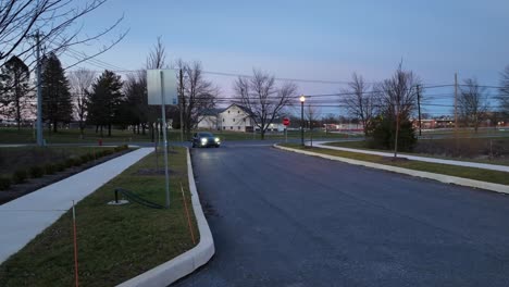 Blue-Tesla-Model-Y-self-driving-on-American-neighborhood-road