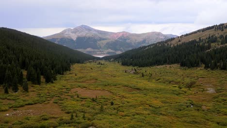 4k-Aerial-Drone-footage-over-field-meadow-at-Mayflower-Gulch-in-Rocky-Mountains-Colorado-Summit-County-near-Leadville-and-Copper-Mountain