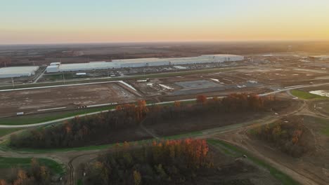 Mid-Altitude-strafe-of-Ford's-Megacampus,-BlueOval-City-at-Sunset-in-Stanton,-TN