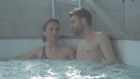 A-couple-in-a-jacuzzi-stares-at-the-distant-horizon