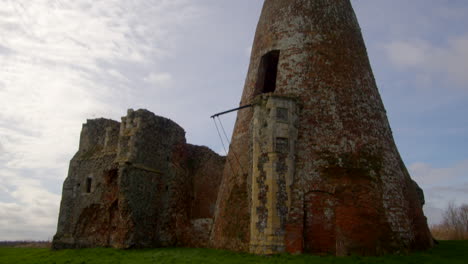 Tilting-Wide-shot-of-St-Benet’s-abbey-16th-century-gatehouse-with-18th-century-windmill