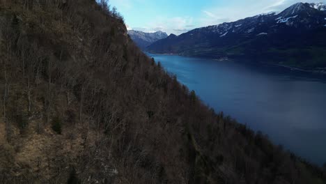 Deep-bluish-lake-water-near-the-Seerenbach-waterfall-in-Weesen,-Amden,-Switzerland