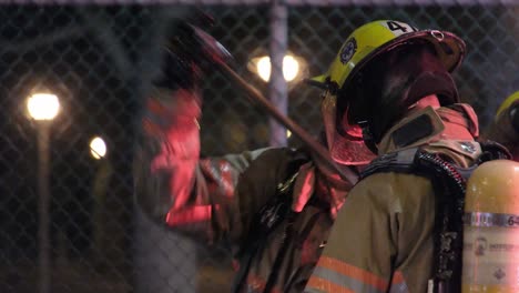 Firefighters-Decontamination-Process---Fellow-Fireman-Removing-Contaminants-From-PPE-After-Fires