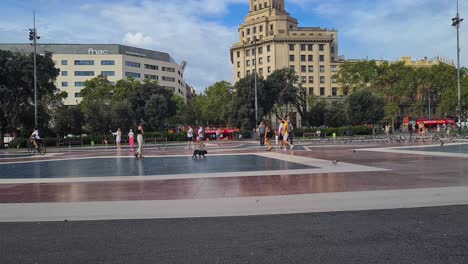 Barcelona-Spain-City-Life,-People-Walking-on-Plaza-Catalunya-on-Summer-Day