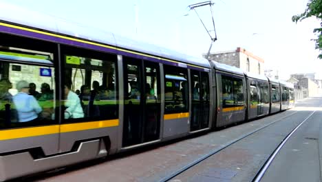 Electric-tram-transporting-tourists-on-a-deserted-street-in-Dublin