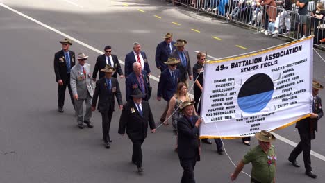 Representatives-from-the-49th-Battalion-Association-Semper-Fidelis-marching-down-Adelaide-Street-in-the-Brisbane-city,-amidst-the-solemnity-of-the-Anzac-Day-commemoration