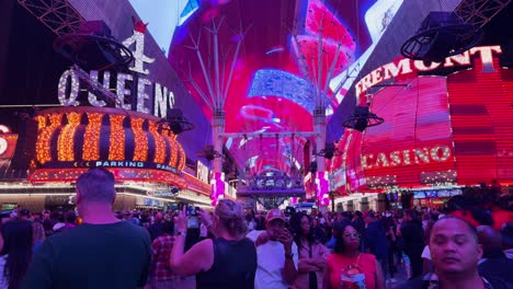 POV-Walking-Along-Illuminated-Freemont-Street-In-Las-Vegas-Soaking-Up-The-Atmosphere