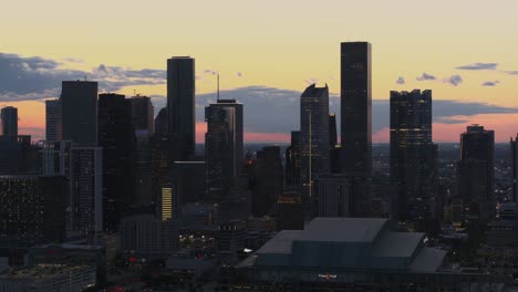 High-angle-drone-shot-of-downtown-Houston,-Texas-at-night