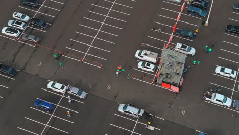 People-Wearing-Green-Shirts-At-Parking-Lot-Of-Oakland-Athletics,-Protesting-To-Boycott-Baseball-Team-In-Oakland,-California