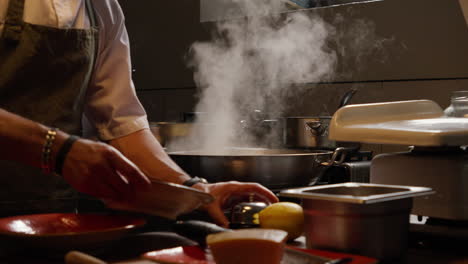 Chef-preparing-meal-in-steamy-kitchen-atmosphere