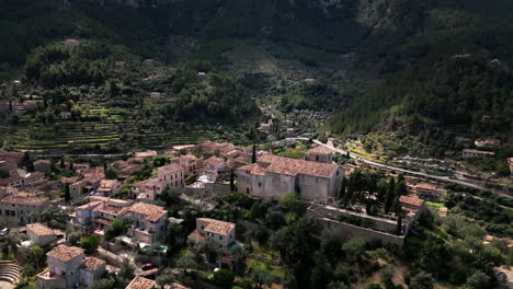 Aerial-view-of-Deia-village-nestled-in-Mallorca's-mountains