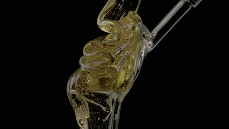 Close-up-of-pouring-honey-liquid-over-the-spoon,-dark-background,-the-essence-of-pure-sweetness,-immersing-in-a-sensory-experience-like-no-other