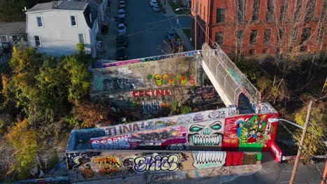 Graffiti-on-abandoned-train-tracks-in-American-city-during-autumn-sunset