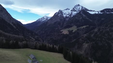 Aerial-view-of-drone-fly-above-Austrian-Alps-surrounded-by-mountain-landscape-at-Bazora,-Vorarlberg,-Austria