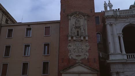 Close-up-slow-tilt-shot-view-of-an-beautiful-old-Italian-building-and-tower-in-Vicenza-Italy