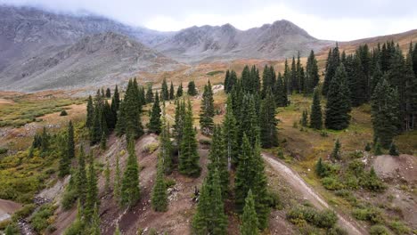 4k-Aerial-Drone-Footage-of-Trees-and-Forest-at-Mayflower-Gulch-with-mist-on-mountains-near-Leadville-and-Copper-Mountain-Colorado-Summit-County