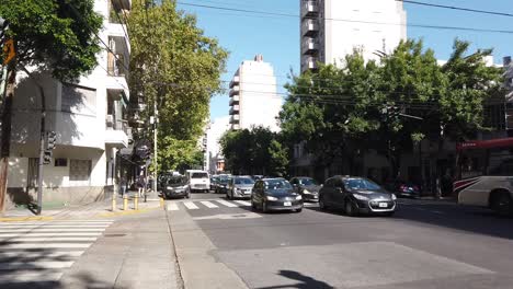 Hyperlapse-people-walk-car-traffic-at-buenos-aires-city-flores-neighborhood-town-of-latin-america-in-autumn,-urban-area,-pedestrians,-carabobo-avenue