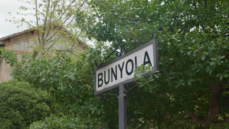 Green-trees-frame-the-Bunyola-town-sign-in-Mallorca