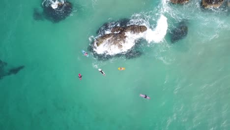 Aerial-view-of-surfers-waiting-for-the-waves
