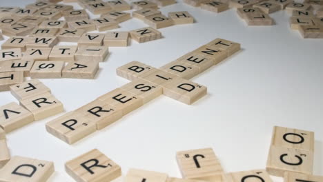 close-up:-Scrabble-letter-tiles-form-crossword-of-PRESIDENT-and-BIDEN