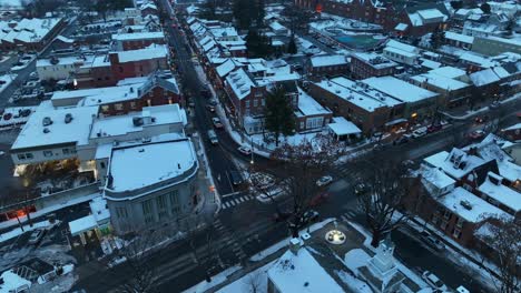 Traffic-scene-in-snowy-american-town-at-dusk