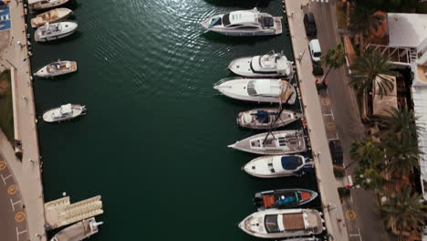 Aerial-view-of-luxury-yachts-docked-in-Cala-d'Or-marina,-Mallorca