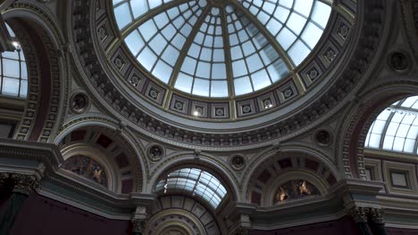 Looking-Up-At-Dome-Ceiling-Above-Room-36-With-Pan-Down-To-Reveal-Visitors-Walking-Past-In-The-National-Portrait-Gallery-in-London