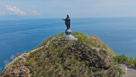 Cape-Fatucama,-Dili,-East-Timor---Cristo-Rei-of-Dili-Statue---Aerial-Pullback-Shot