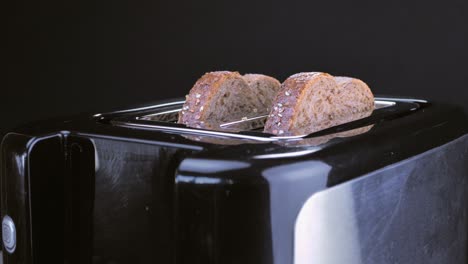 Roasted-toast-bread-popping-up-from-toaster