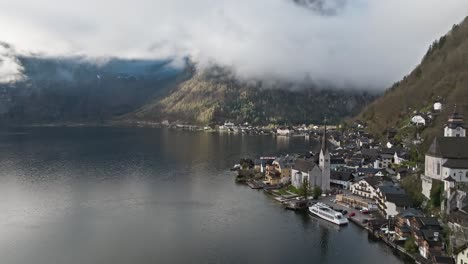 Overlooking-hallstatt-Austria-and-the-Austrian-alps-in-a-slow-cinematic-fly-away-shot