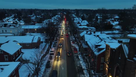 Busy-Traffic-at-night-in-small-american-town