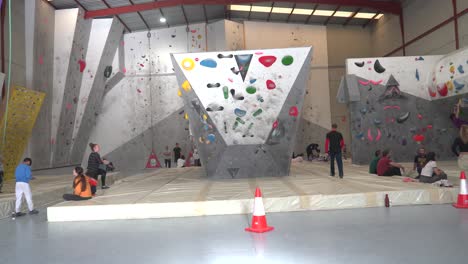 Murcia,-Spain,-April-3,-2024:-Woman-climbing-indoor-safely-in-climbing-wall