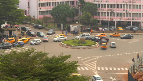 Multi-Colored-Vehicles-At-The-Roundabout-In-Downtown-Yaounde,-Cameroon