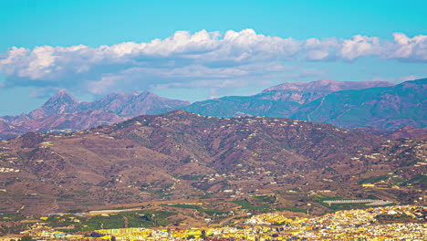Rare-village-in-south-of-Spain,-landscape-of-Malaga-rural-area,-timelapse-on-midday