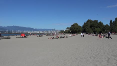 A-group-of-walkers-on-a-beach-in-Vancouver