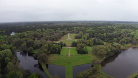 Aerial-wide-reverse-pullback-shot-of-historic-Middleton-Place-Plantation-along-the-Ashley-River-in-low-country-South-Carolina