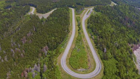 Aerial-drone-shot-panning-downwards-showing-the-famous-Bay-of-Fundy-trail-parkway-located-off-the-Bay-of-Fundy-in-New-Brunswick,-Canada-shot-during-a-hot-summers-day