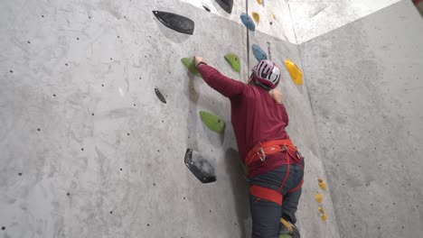 Murcia,-Spain,-April-3,-2024:-Woman-climbing-indoor-safely-in-climbing-wall