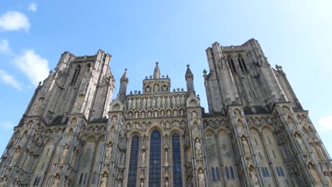 A-group-morris-dancing-to-traditional-English-folk-music-in-public-performance-display-at-Wells-Cathedral-in-Somerset-UK