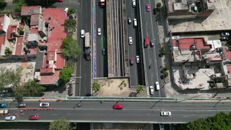 Tilt-up-drone-movement-over-Tlalpan,-one-of-the-most-important-highways-in-mexico-city