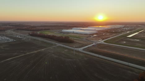 Aerial-approach-Ford's-Megacampus,-BlueOval-City-in-Stanton,-TN-during-a-gorgeous-sunset