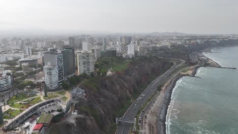 Aerial-drone-morning-footage-of-Lima-skyline,-the-capital-city-of-Peru-in-South-America-Miraflores-Chorrillos-Barranco-Malecón-de-Miraflores-cliffs