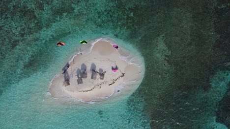 Tropical-Paradise-Island,-Kiteboarders,-Top-Down-Aerial-Shot,-Slow-Motion