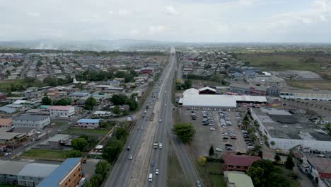 Solomon-Hochoy-Highway,-Chaguanas-Trinidad-and-Tobago-Aerial-Drone-Right-to-left-Fly-over-facing-South-with-Highway-centered-in-frame