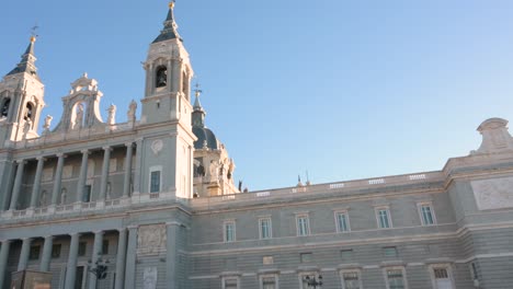 Panning-shot-view-of-the-Roman-Catholic-Almudena-Cathedral,-completed-and-consecrated-in-1993-by-Pope-John-Paul-II-in-Madrid,-Spain