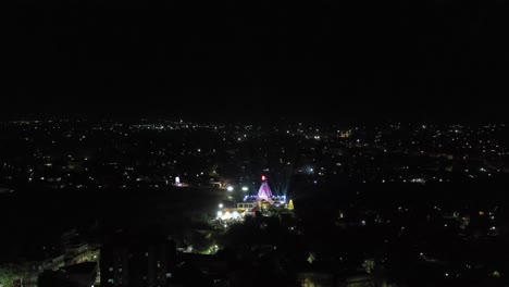 aerial-drone-view-phone-camera-this-temple-mahadev-temple-light-show-is-happening-and-many-buildings-are-visible-around